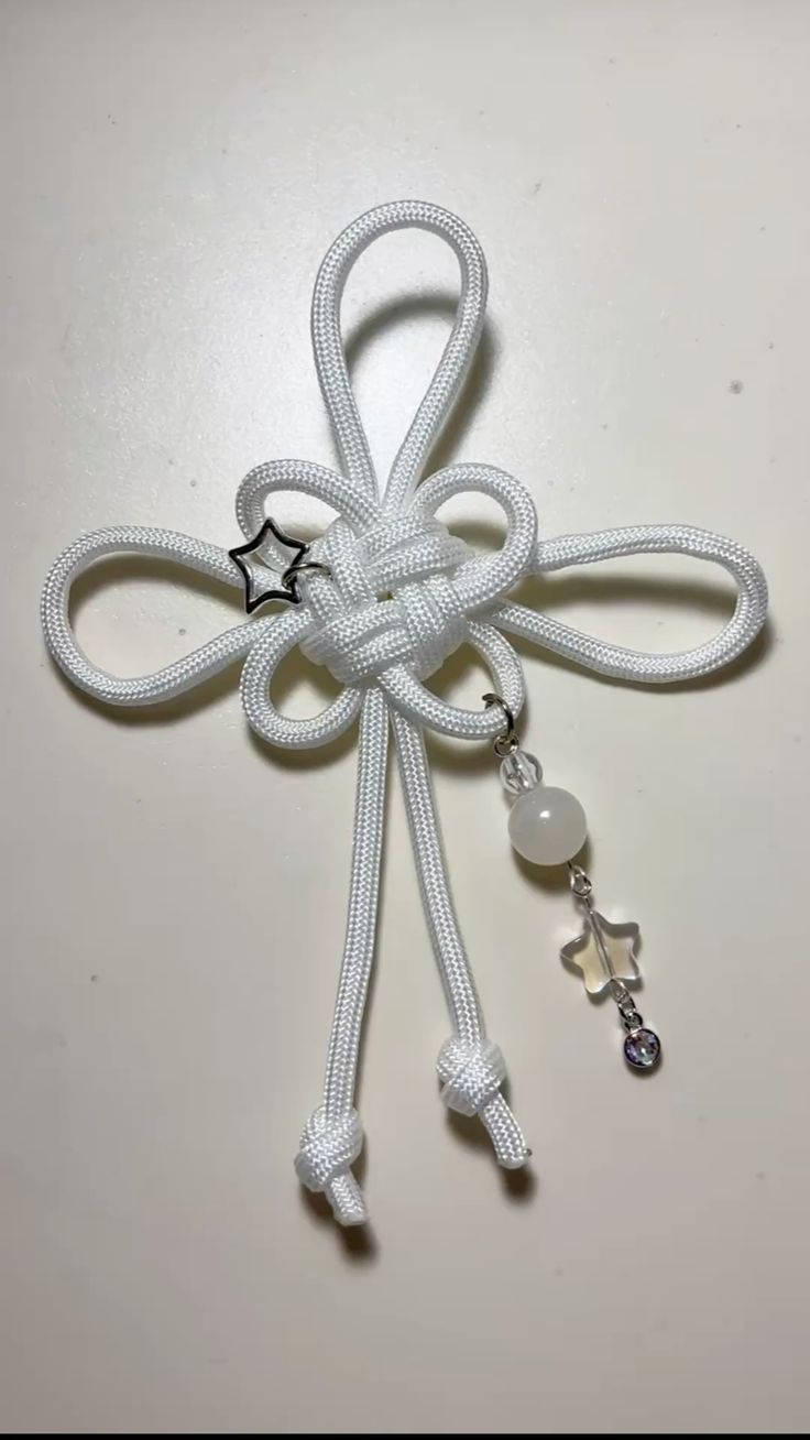 Chinese knot bag charm featuring a four-leaf clover design